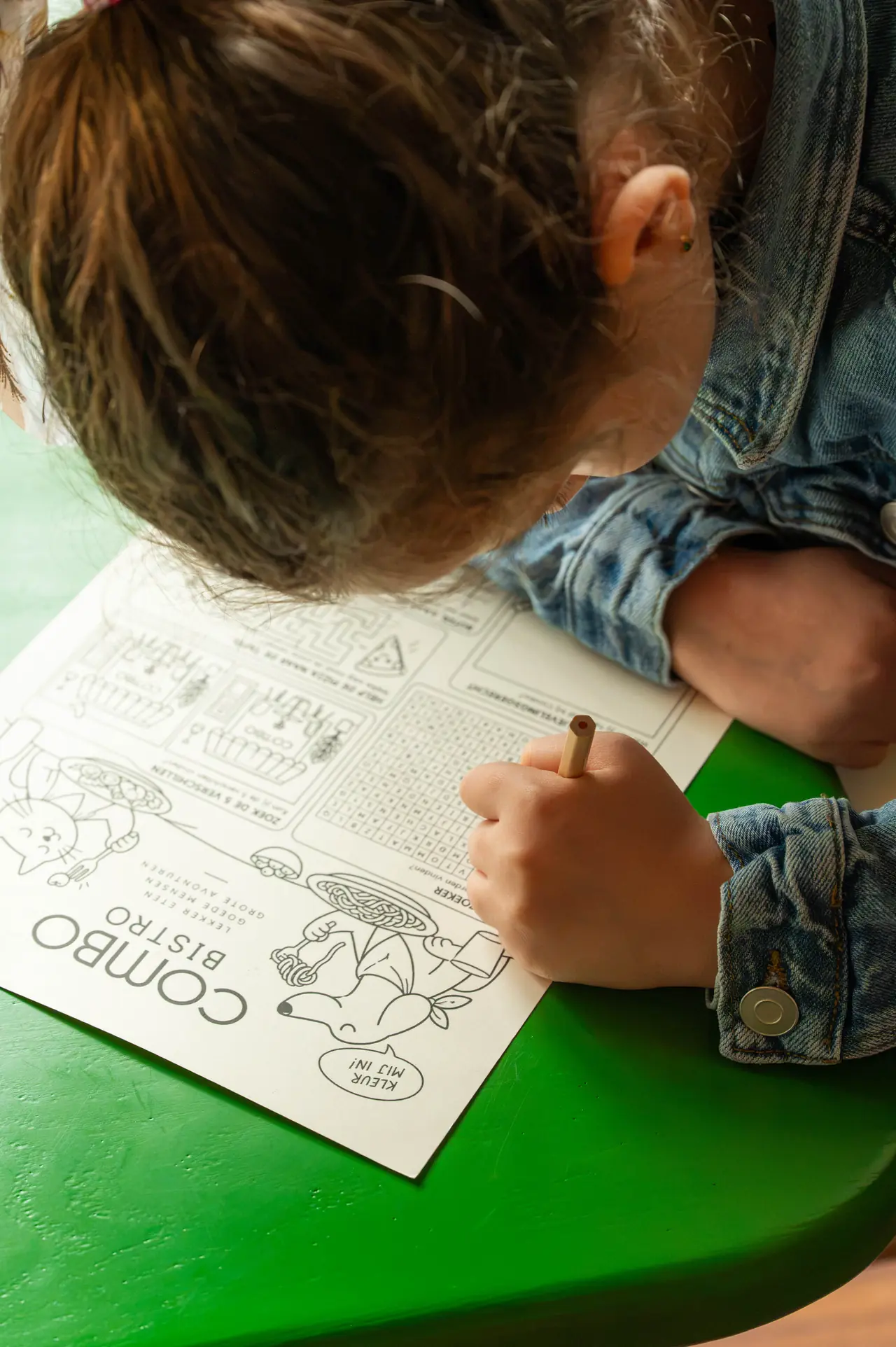 A child drawing on the Combo coloring page