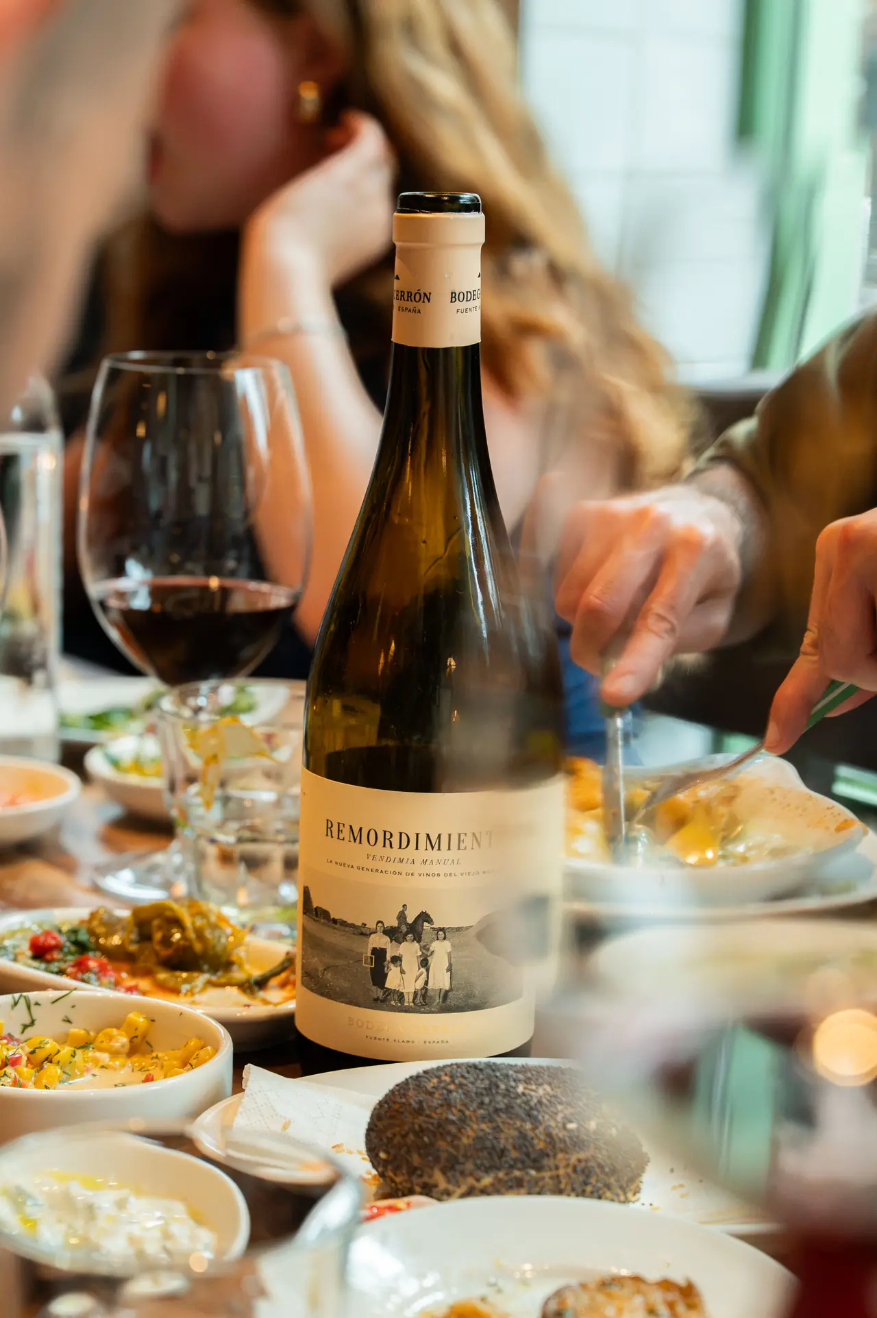 Red wine and small plates at dinner